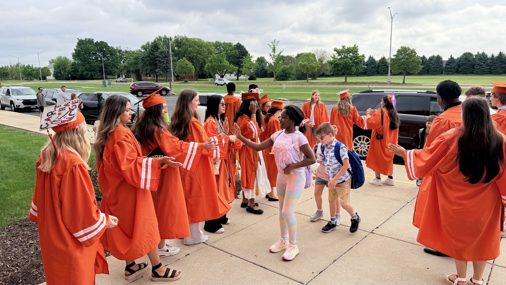Former Eichelberger ES students walk the halls in their caps and gowns