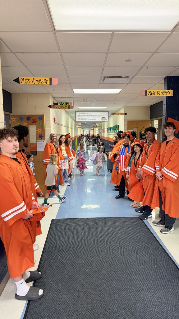 Former Eichelberger ES students walk the halls in their caps and gowns