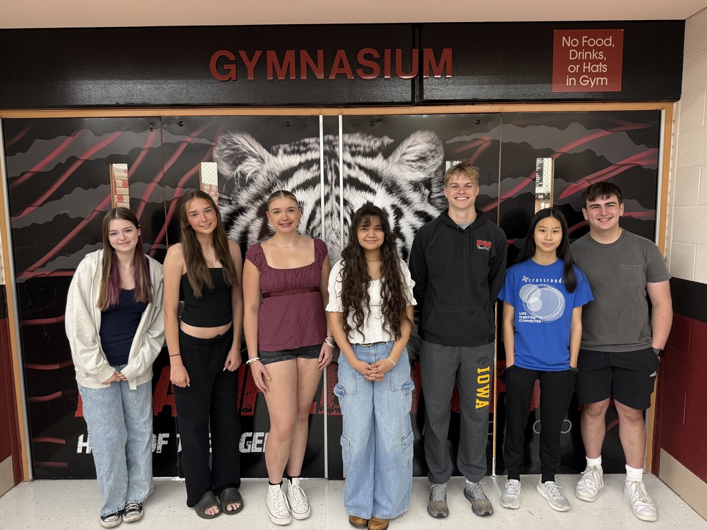 PNHS Horizon summer learning grant recipients stand outside gym door 