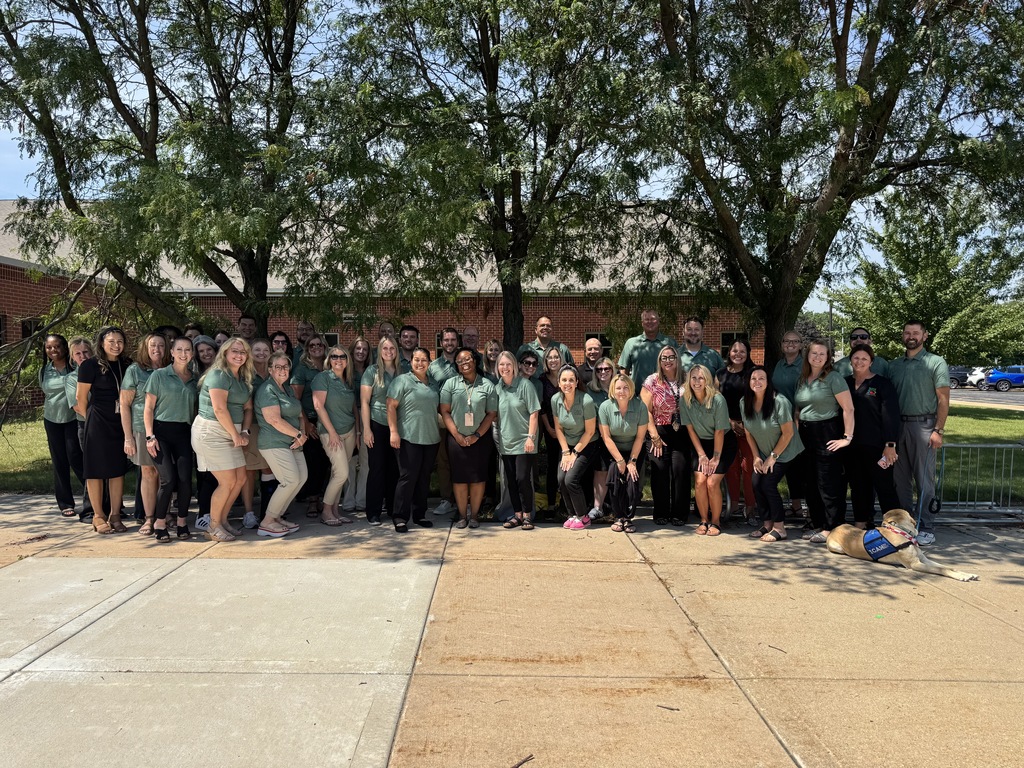 District 202 elementary administrators stand together for a picture outside. 