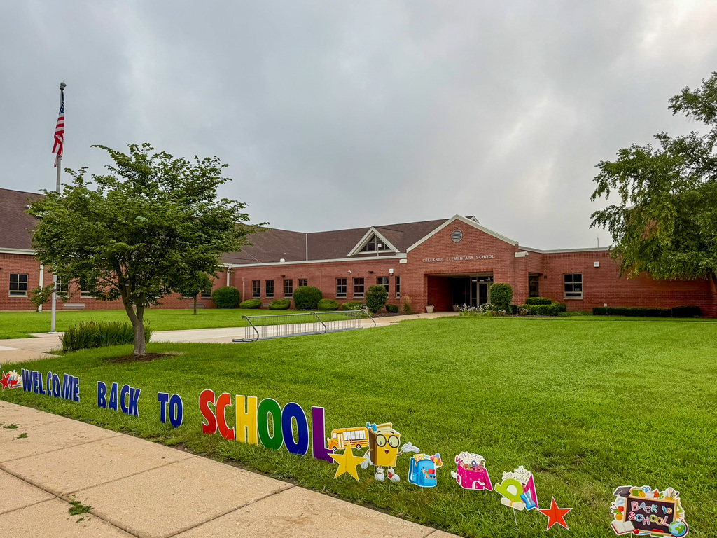 welcome sign outside of building