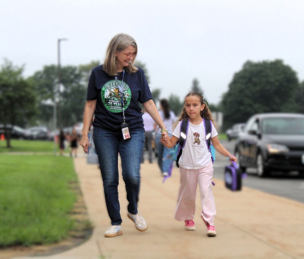 teacher and student walking together