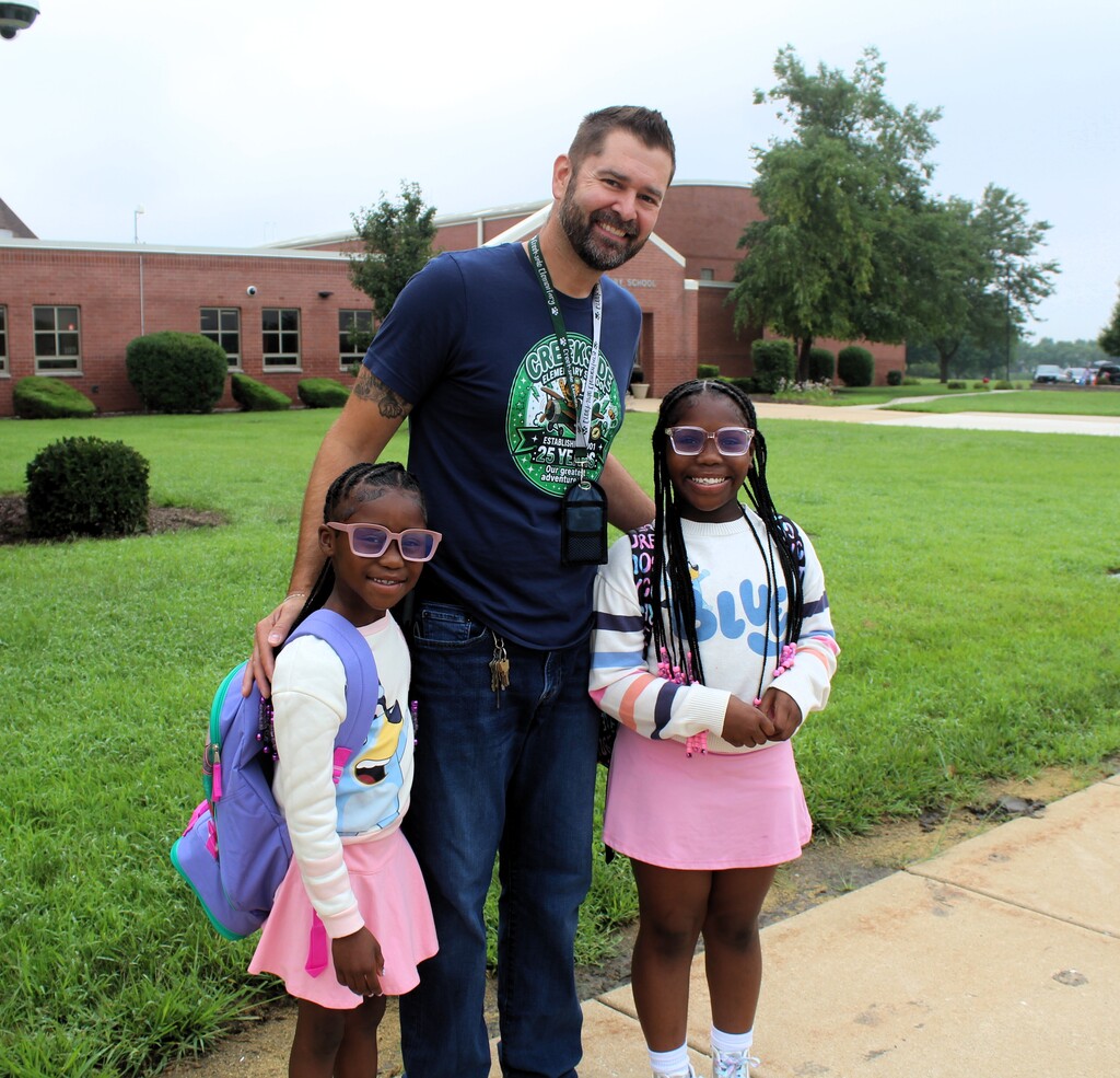 Principal Haymond and two students outside