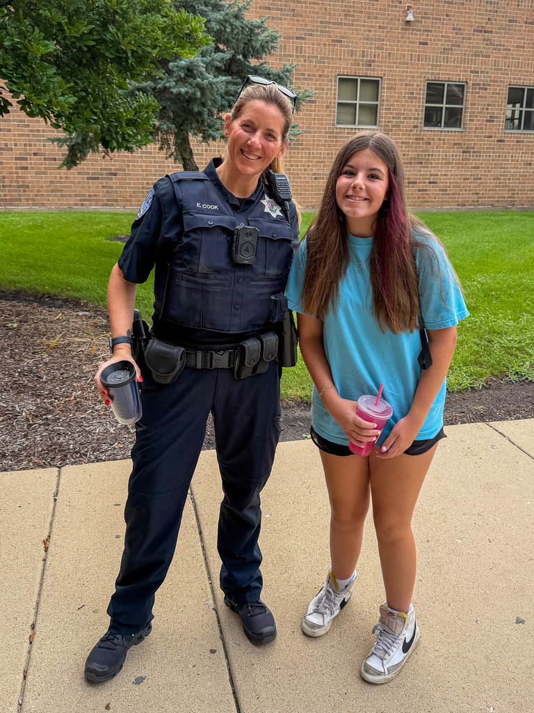 student and officer outside