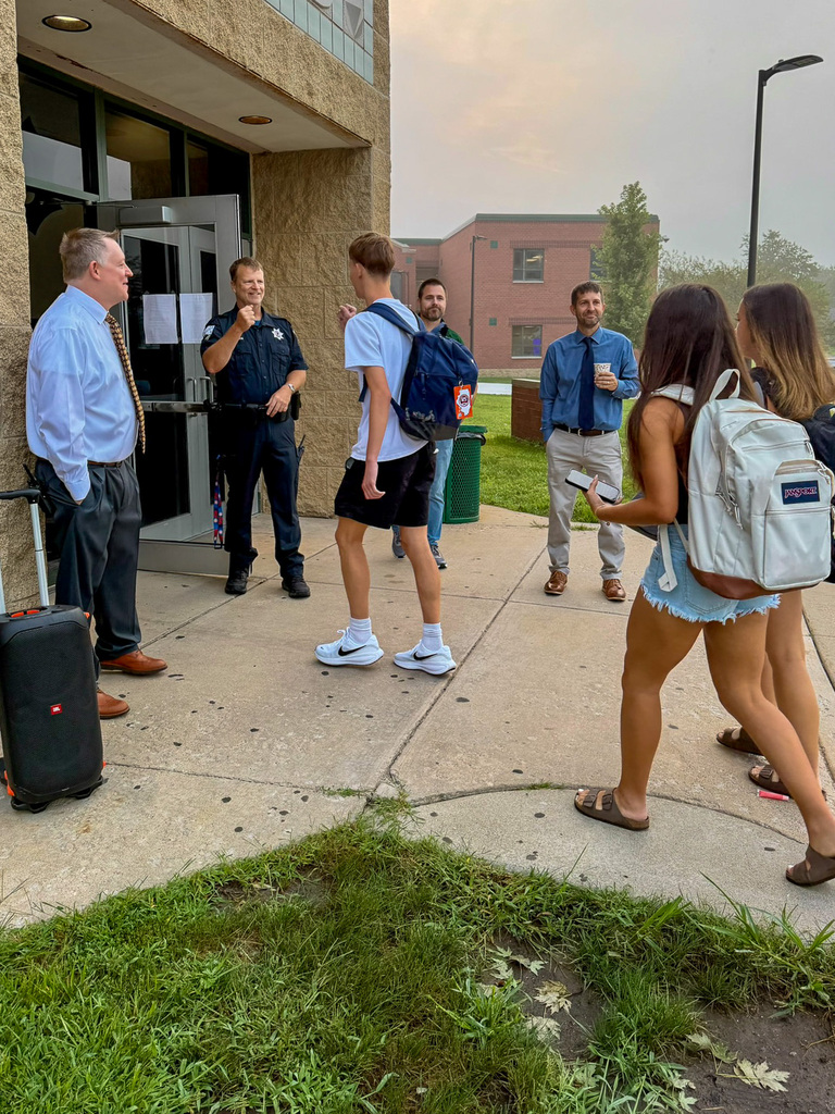 students walk into high school
