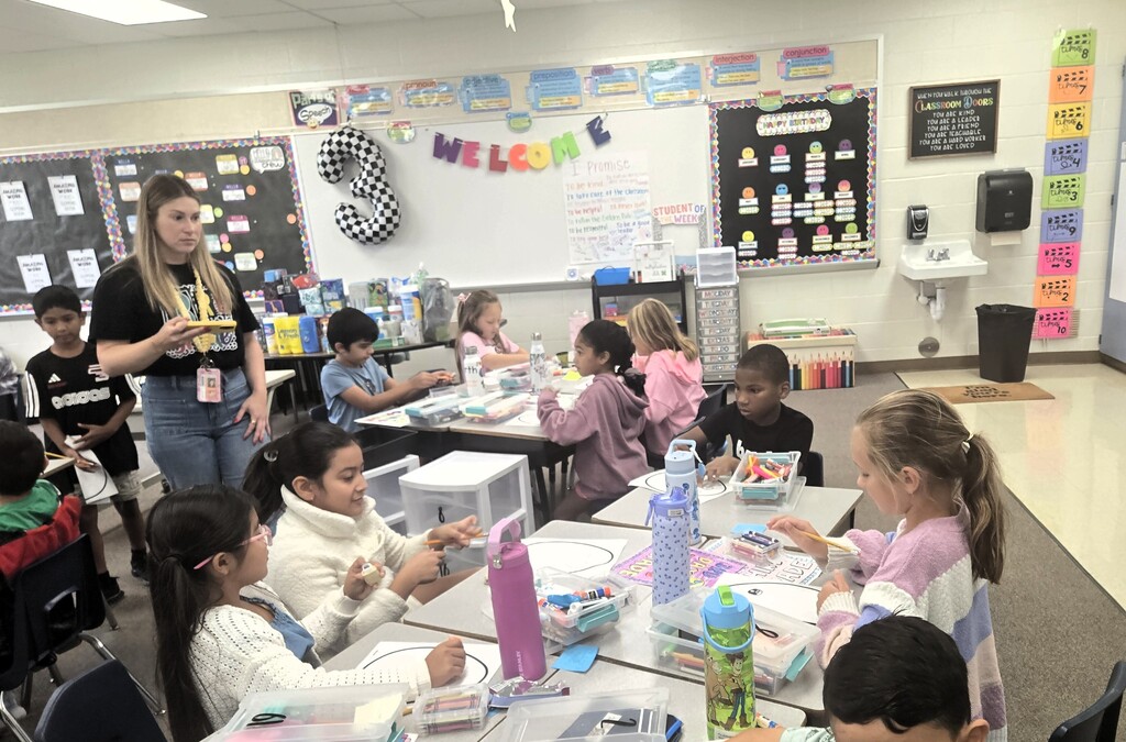 third graders celebrating the third day of school