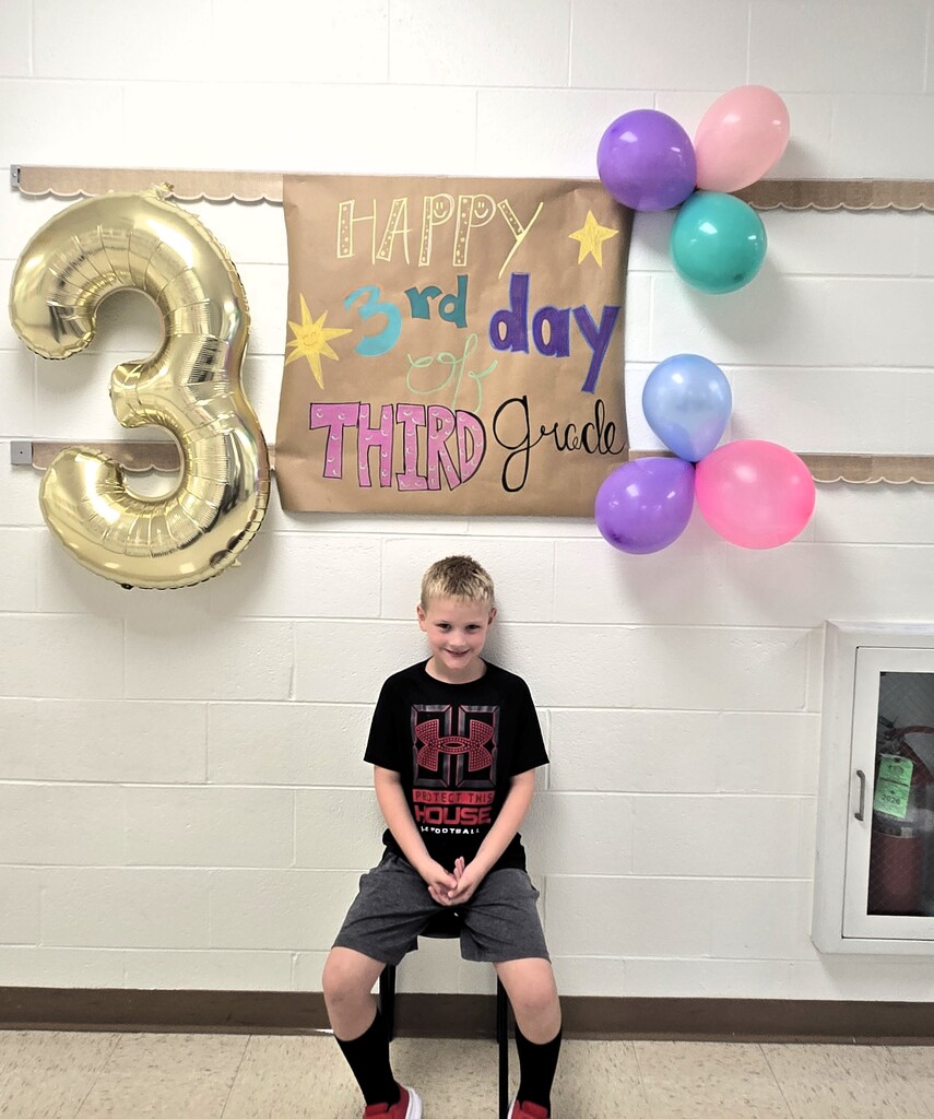 third graders celebrating the third day of school