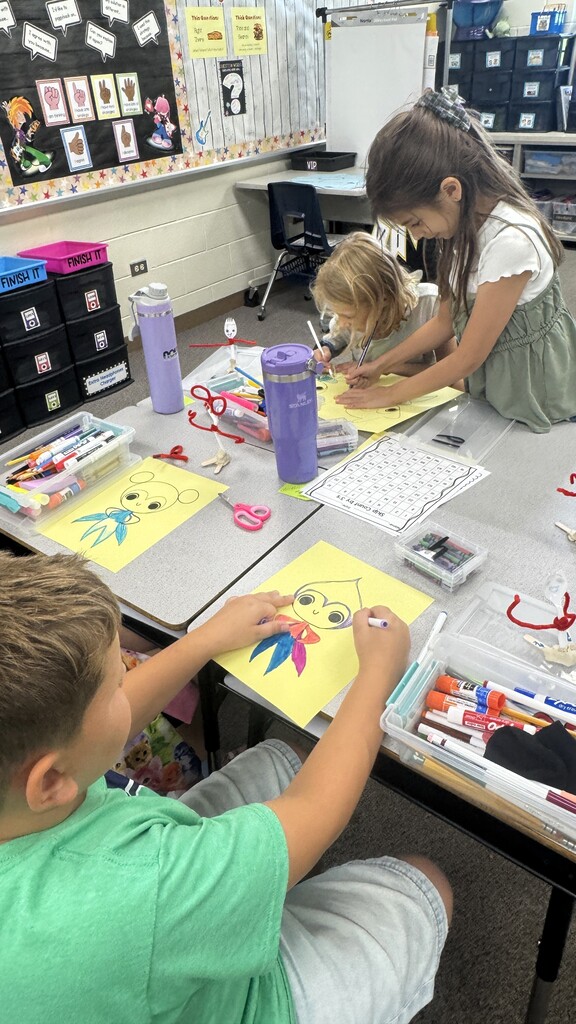 third graders celebrating the third day of school 