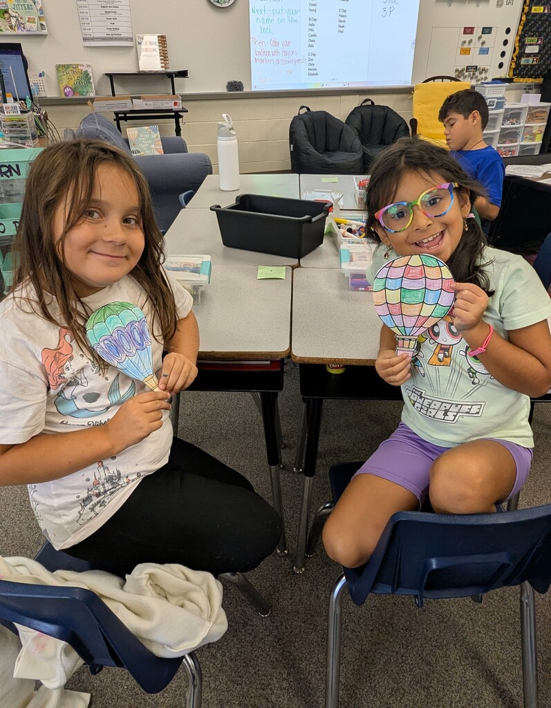 third graders celebrating the third day of school