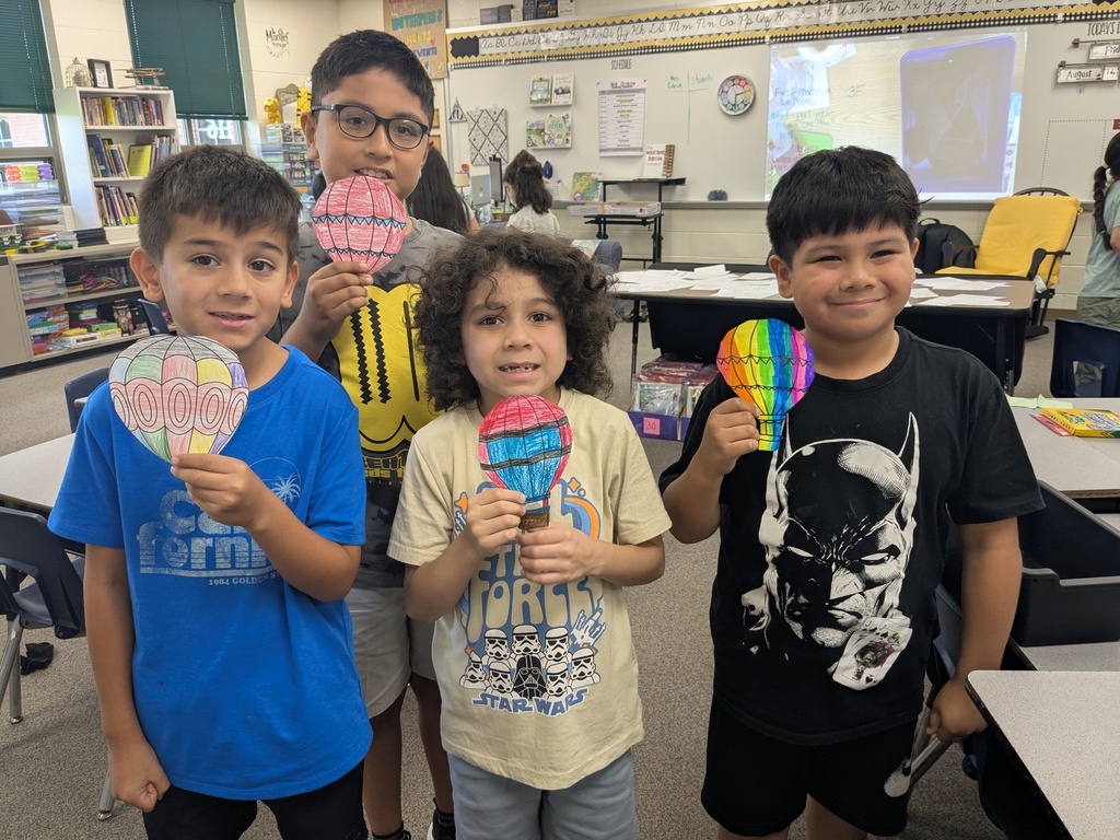 third graders celebrating the third day of school