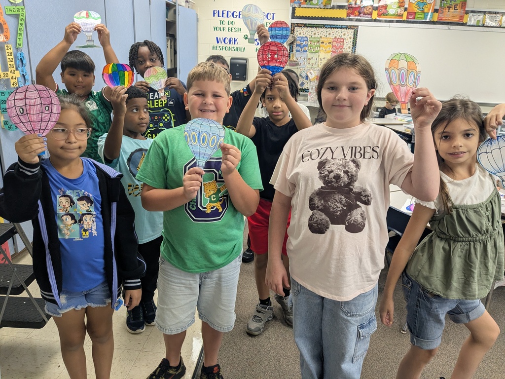 third graders celebrating the third day of school