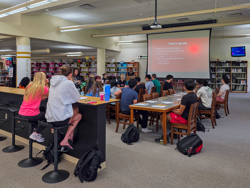 group of high school students listening to presentation 