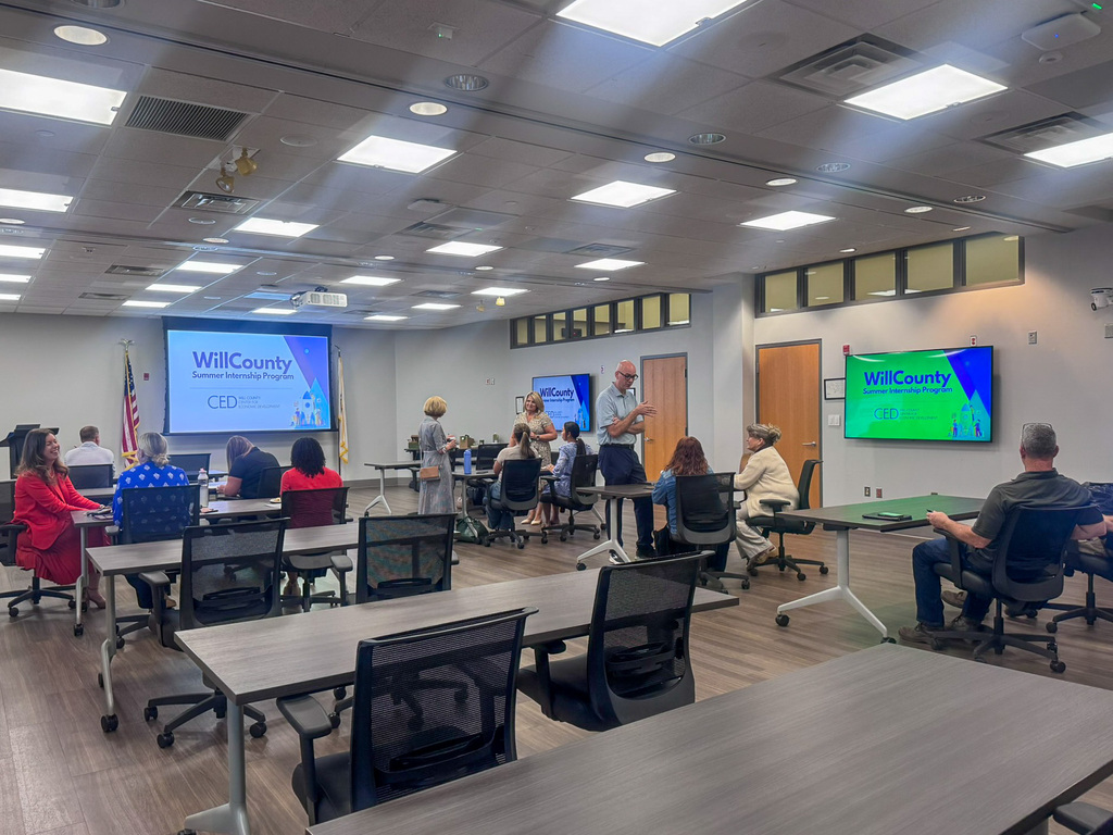 group of people sitting in conference room