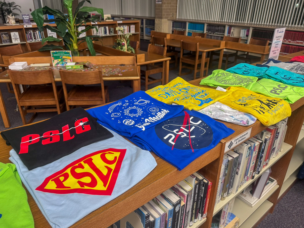 T-shirts with various PSLC logos on them