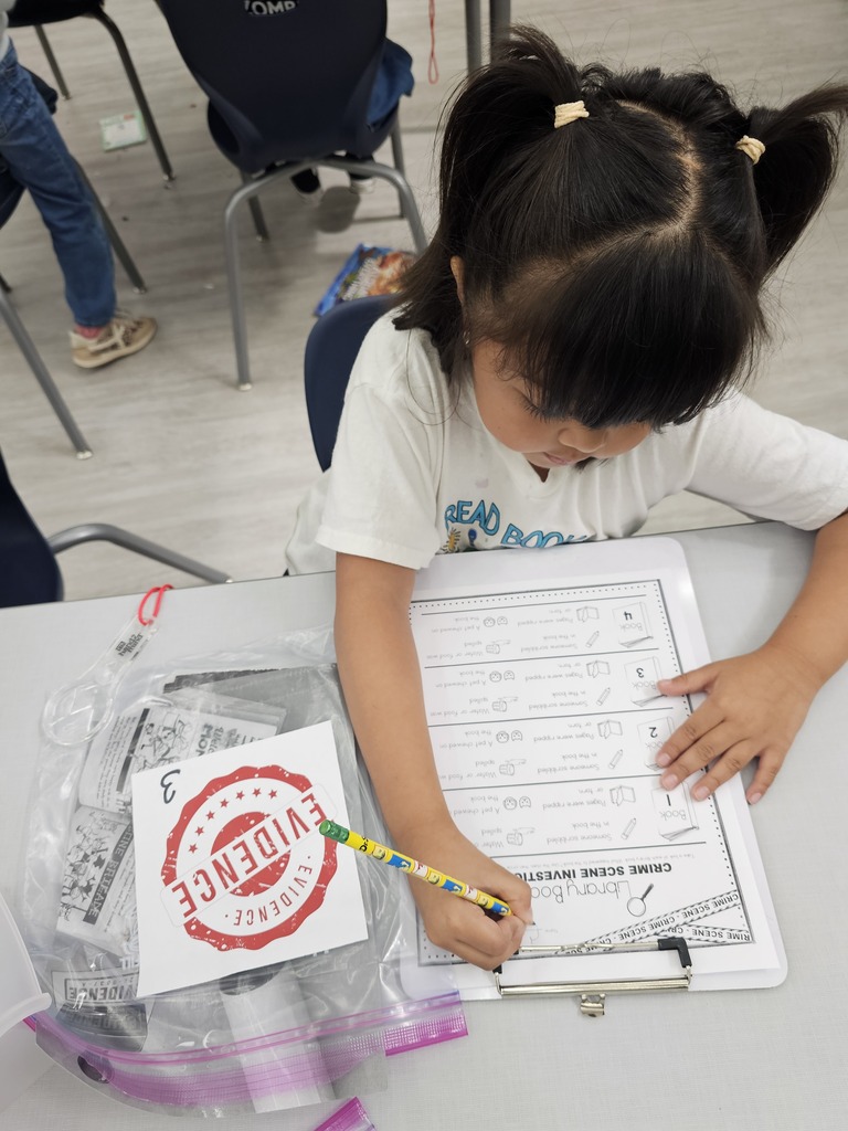 A student writing on a paper.