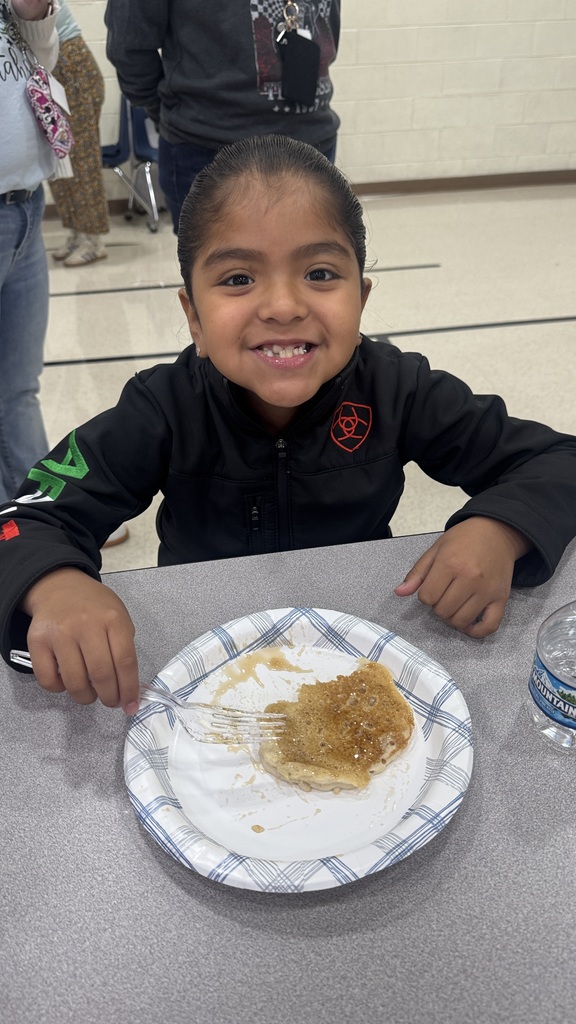 student eating a pancake