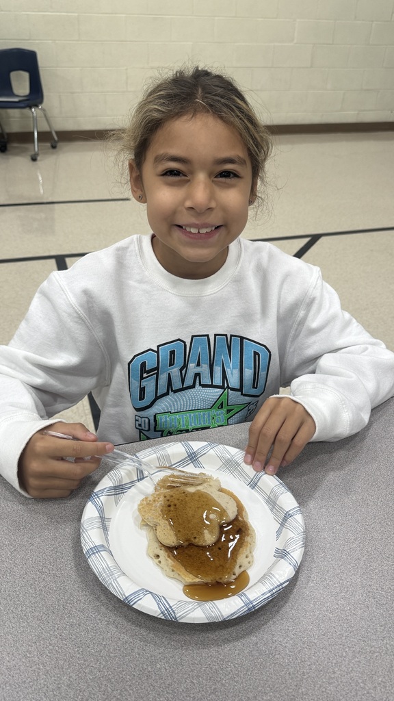 student eating a pancake