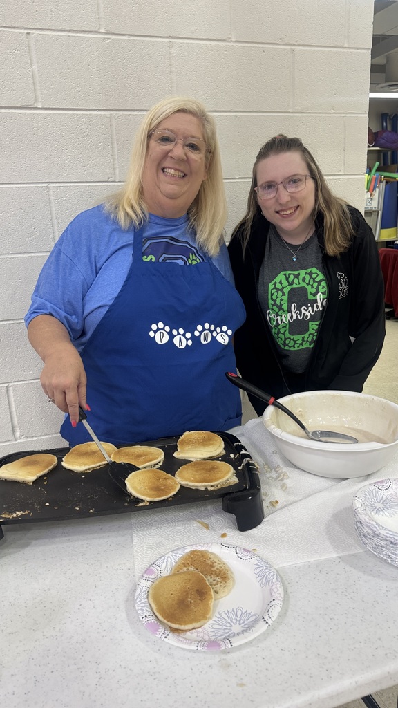 staff serving pancakes