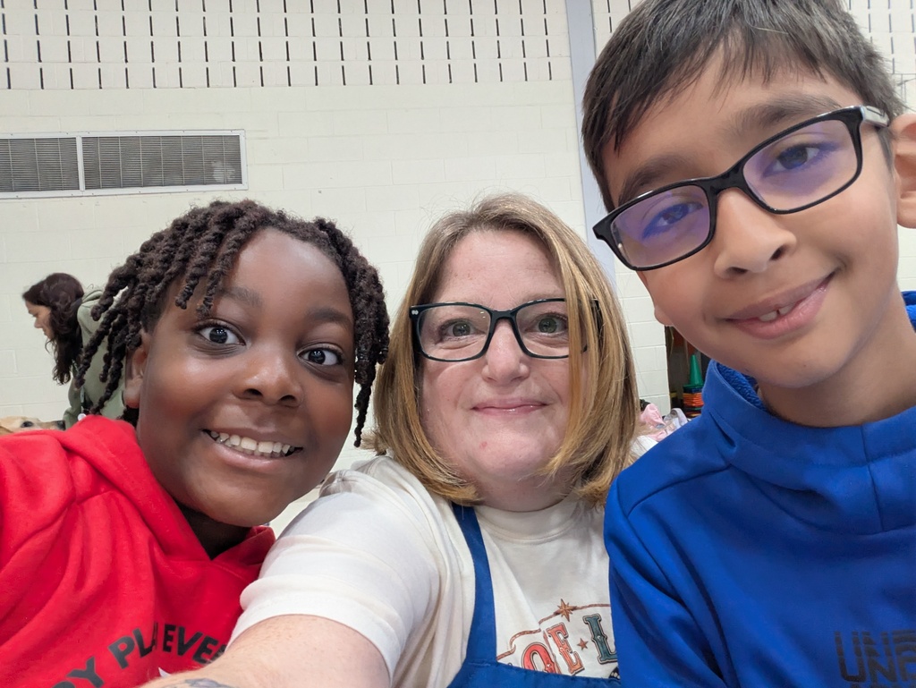 students and staff pose for a picture