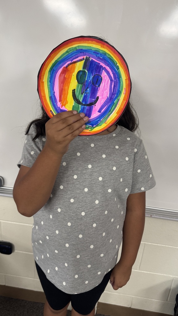 Creekside ES students holding their artwork