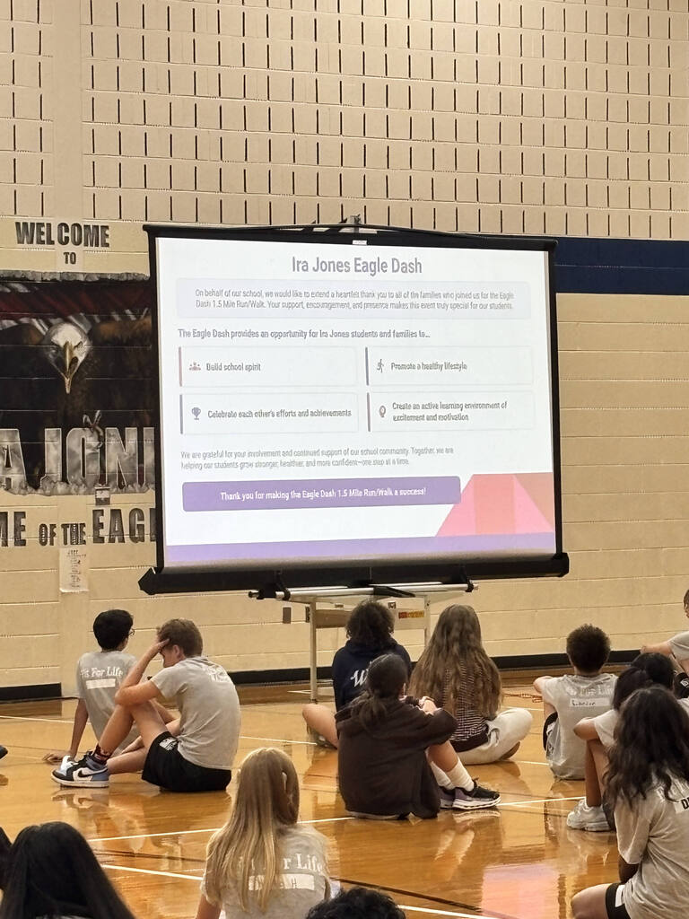 students and parents in gym for Eagle Dash