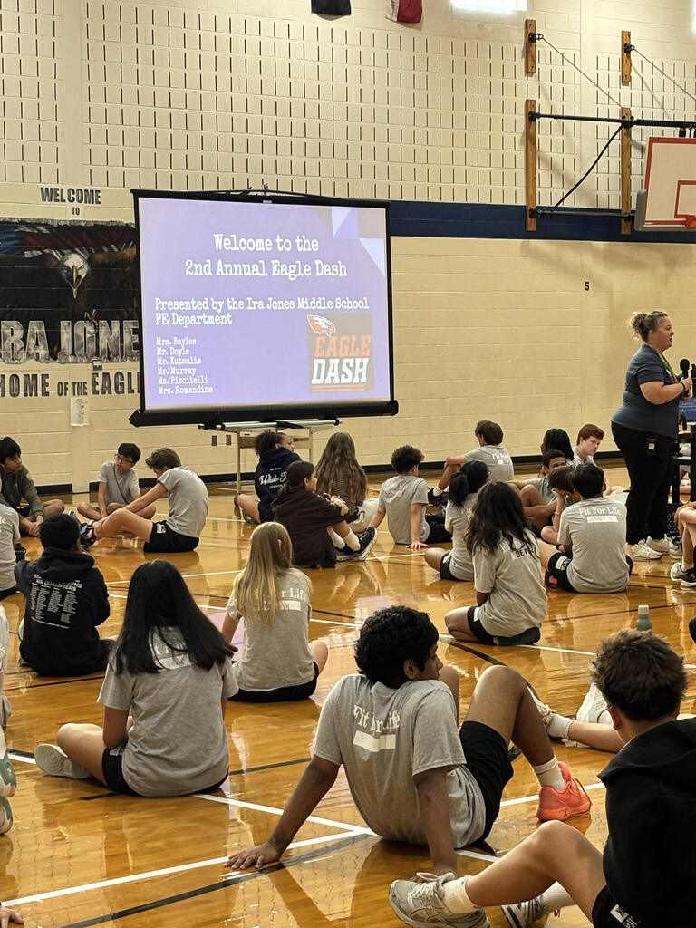 students and parents in gym for Eagle Dash