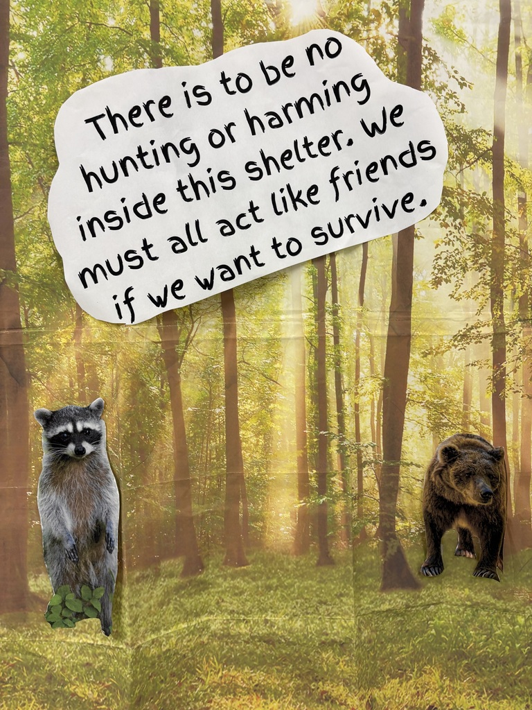 A forest backdrop hanging on the wall with paper animal, cut outs and a quotation.