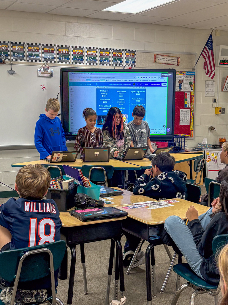 group of fourth graders present on project in front of classmates