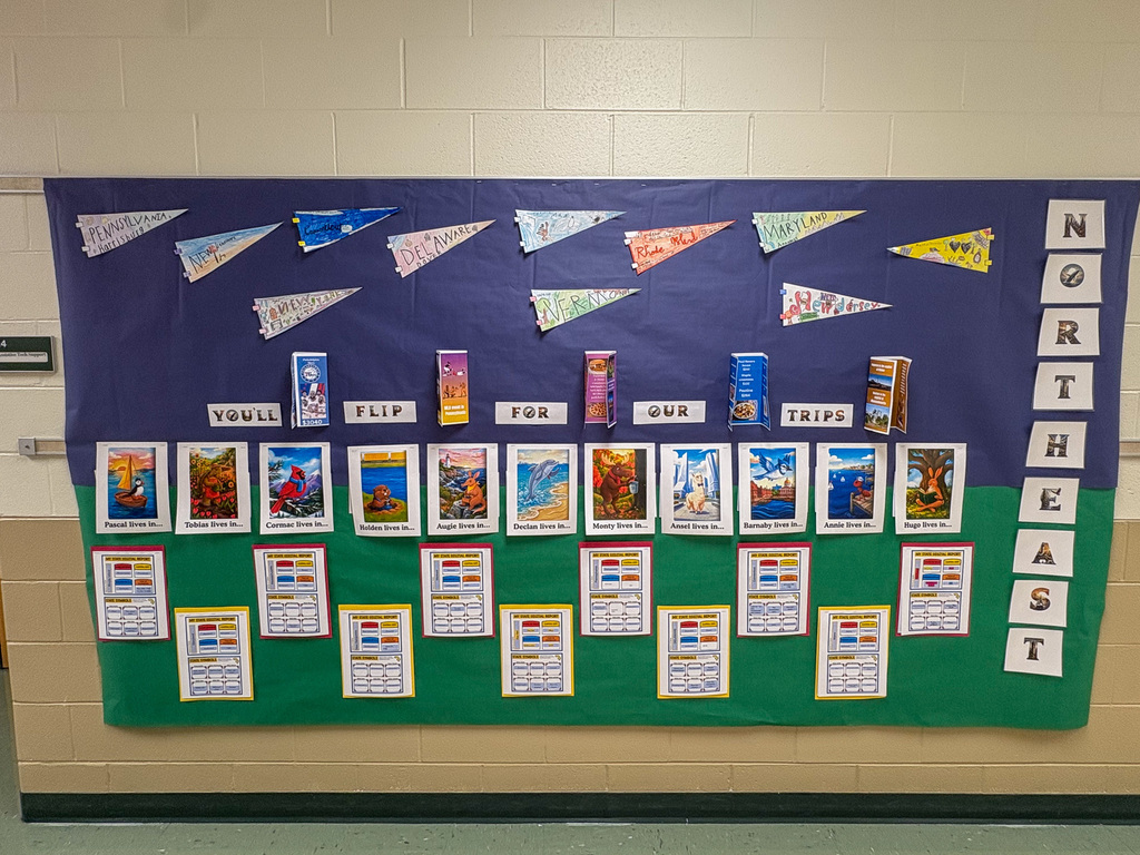 bulletin board displays student travel brochures for Northeast projects