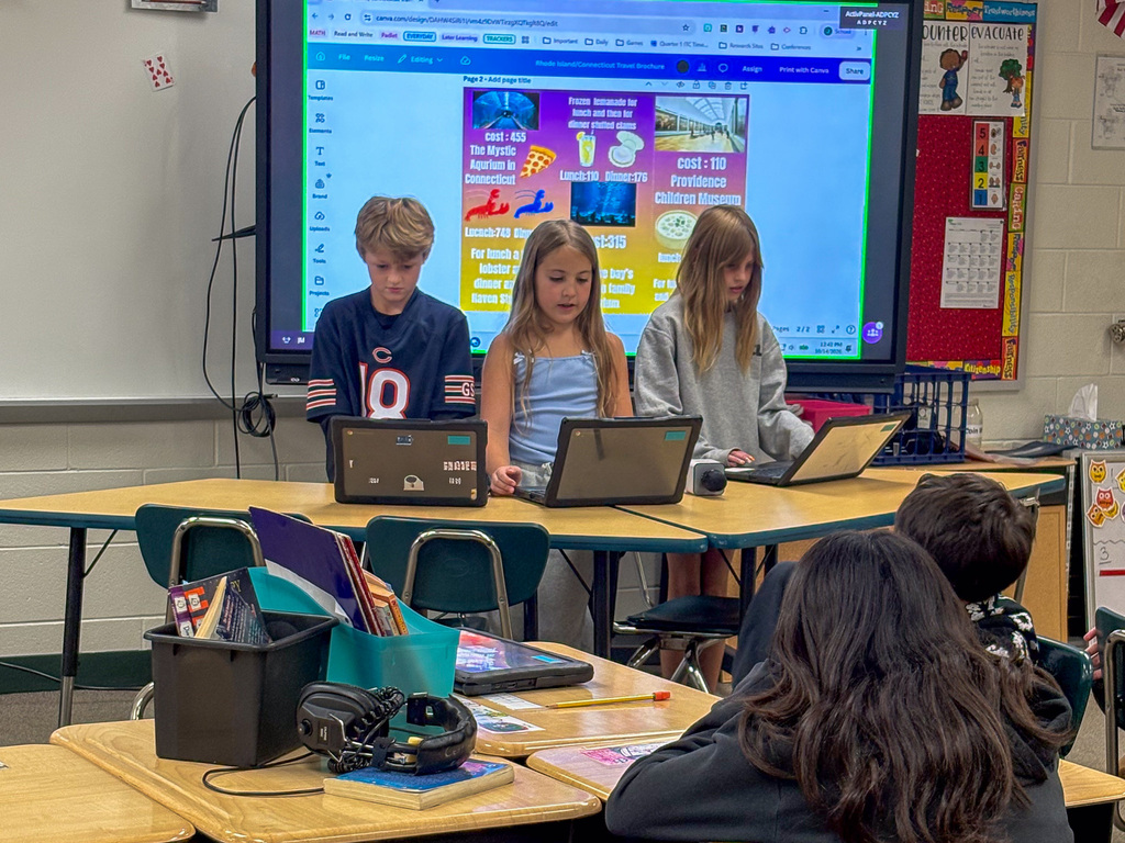 group of fourth graders present on project in front of classmates