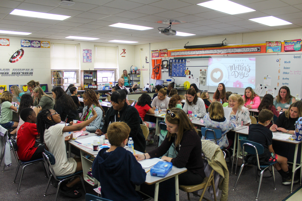 overview photo of classroom filled with adults and kids