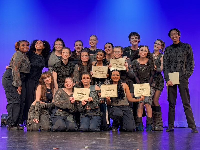 PNHS a cappella group on stage performing
