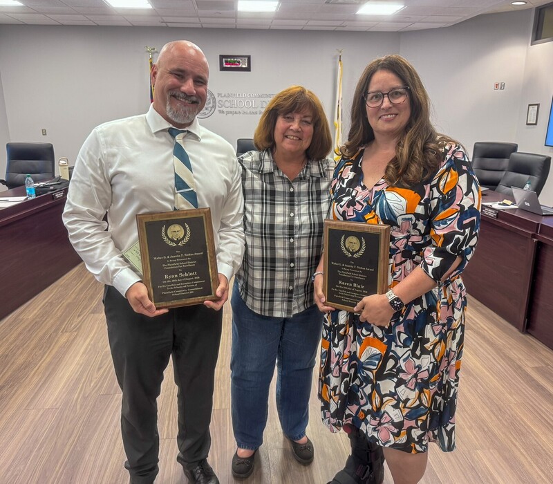 Ira Jones Middle School music teacher Karen Blair (right) and District 202 Director of Technology Ryan Schlott (left) receive the 2026 Niehus Award during the District 202 Board of Education meeting on Wednesday, Aug. 26, 2026.