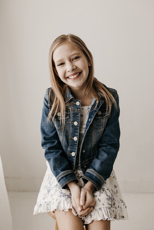 girl sitting on stool