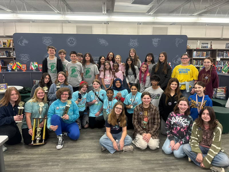 group of middle school students pose after the middle school battle of the books district competition on Thursday, February 26, 2026