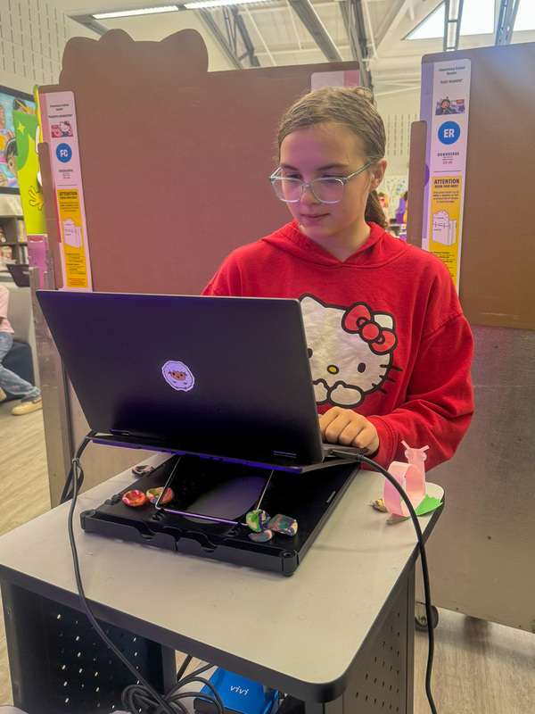 fifth grader works on computer