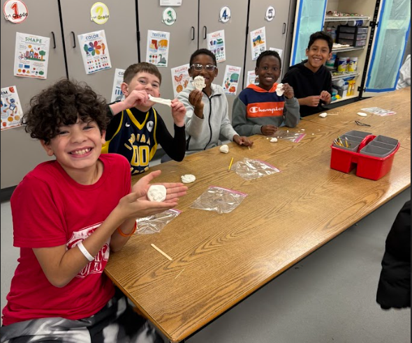 Students making ornaments in art class