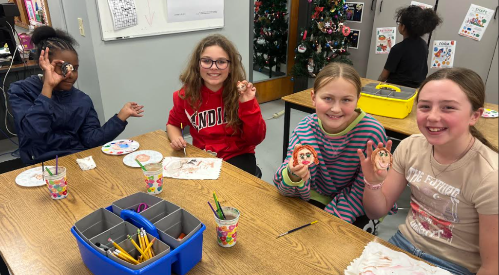 Students making ornaments in art class