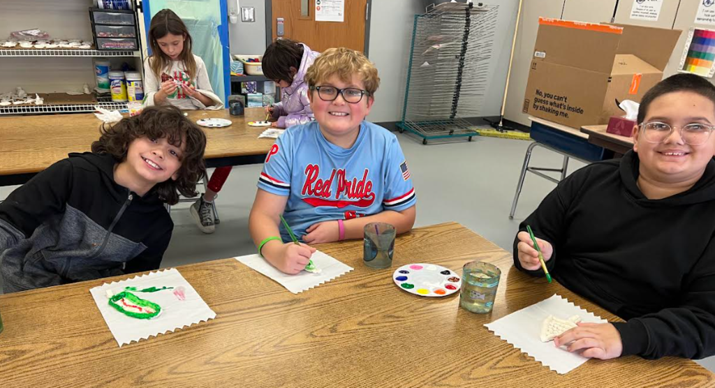 Students making ornaments in art class
