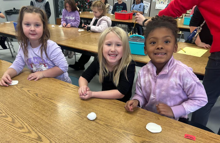 Students making ornaments in art class