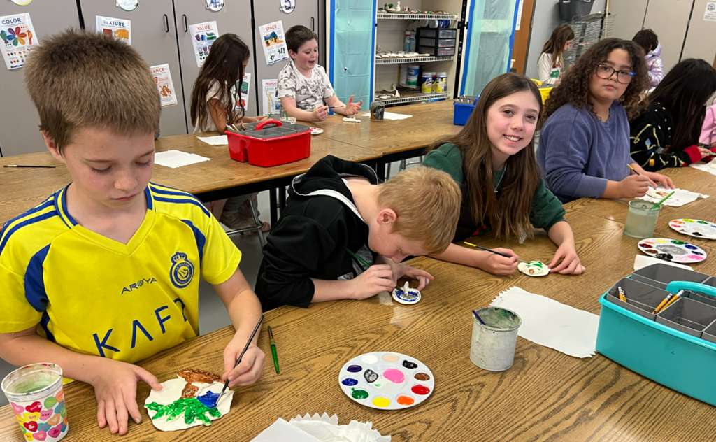 Students making ornaments in art class