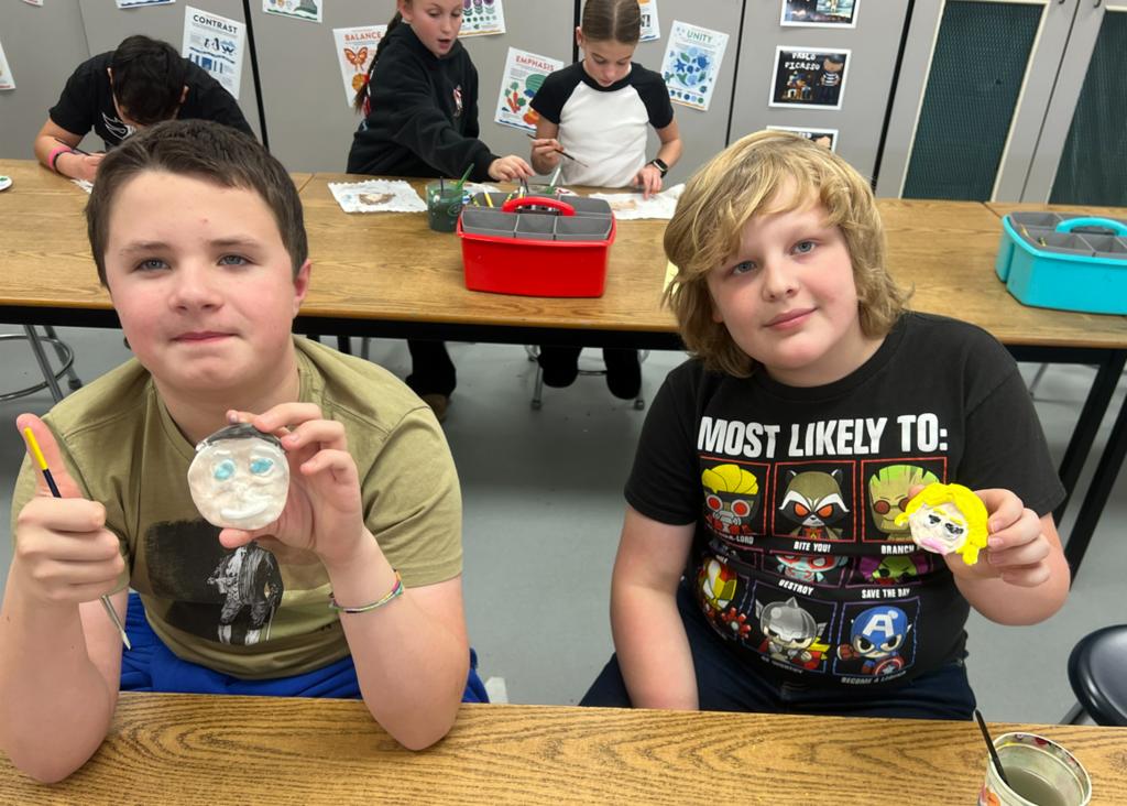 Students making ornaments in art class