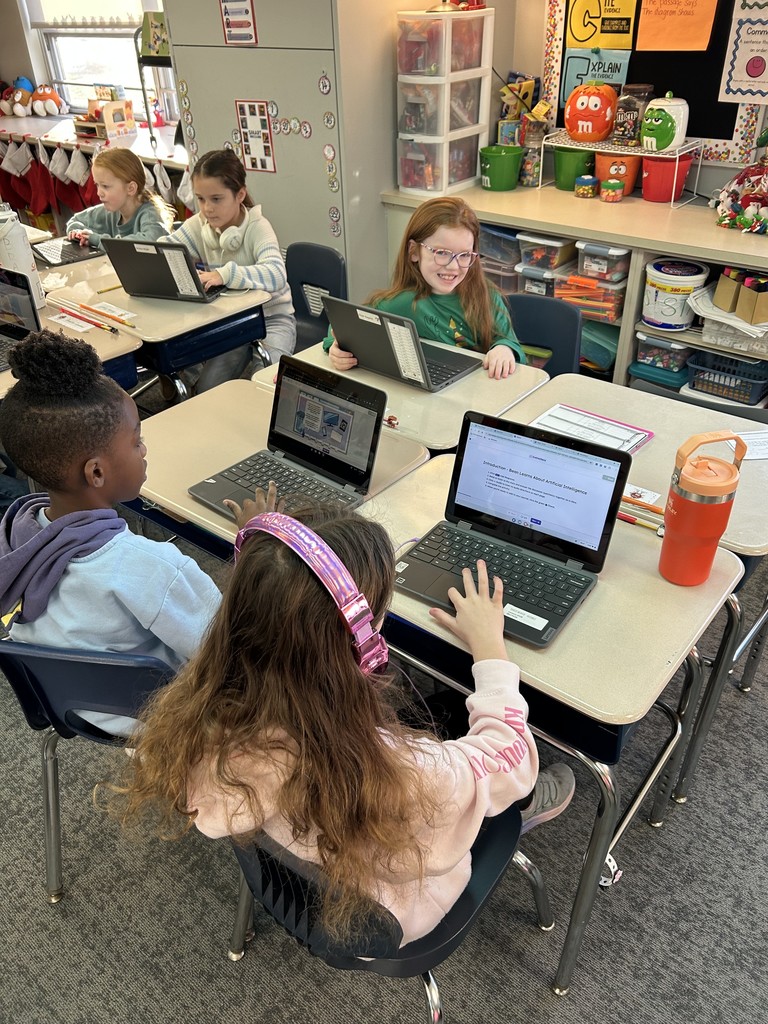 Second grade students participating in AI module