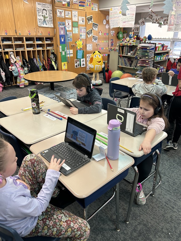 Second grade students participating in AI module