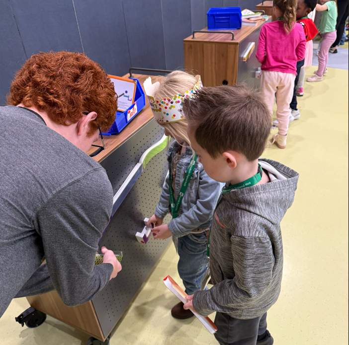 Kindergarteners building marble mazes