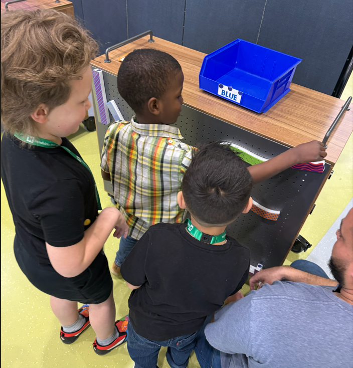 kindergarteners making marble mazes