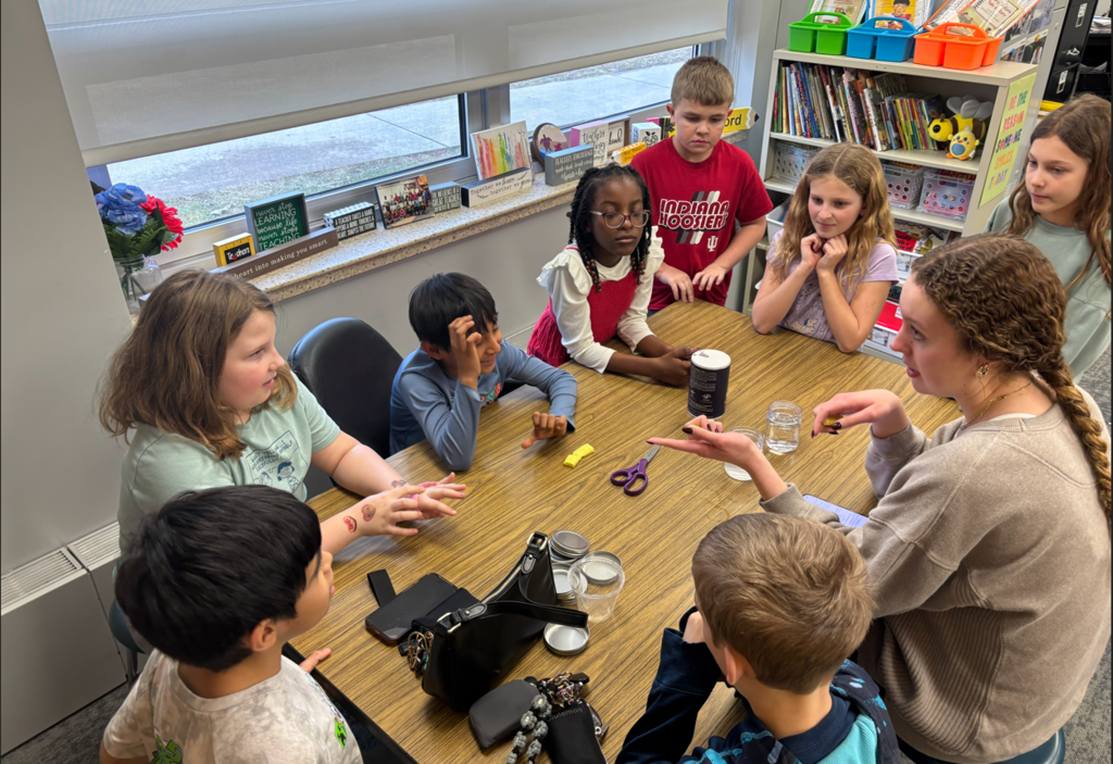 Third graders working with HOSA students