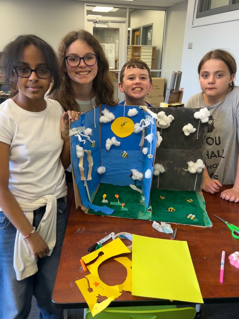 fifth graders with their project