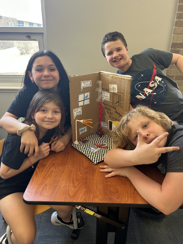 fifth graders with their project