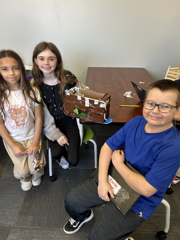 fifth graders with their project